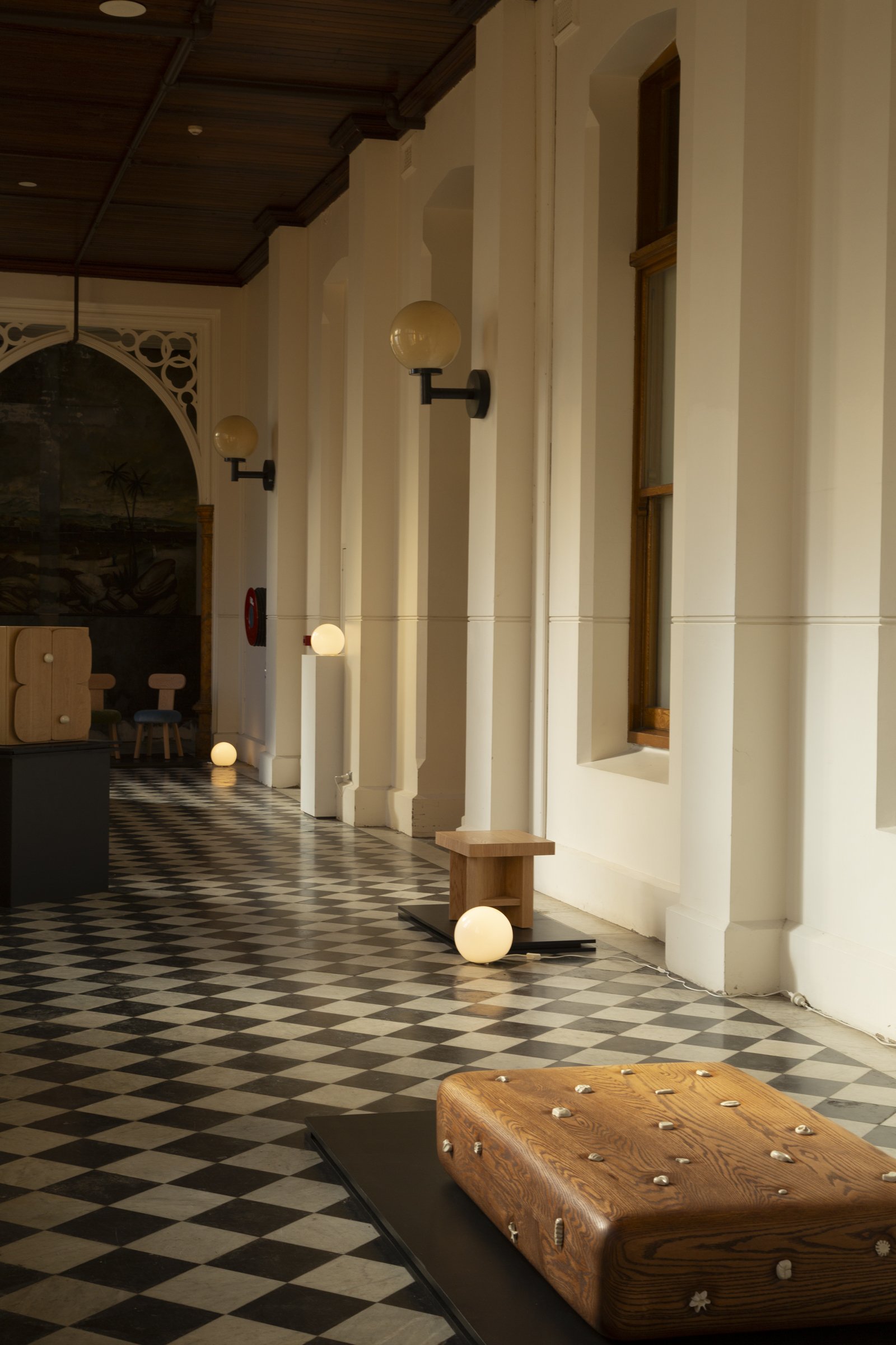 Charmed collection pieces on a checkered floor