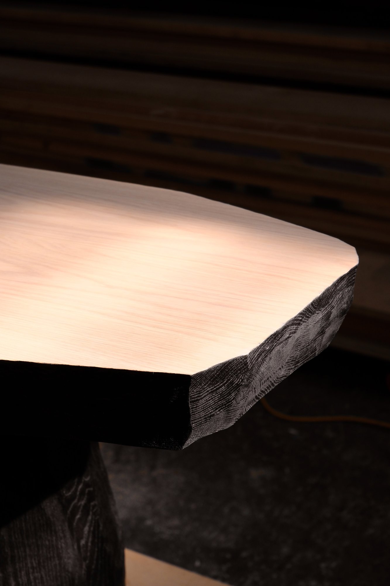 Relief Console corner detail of the smooth top and faceted carved edge